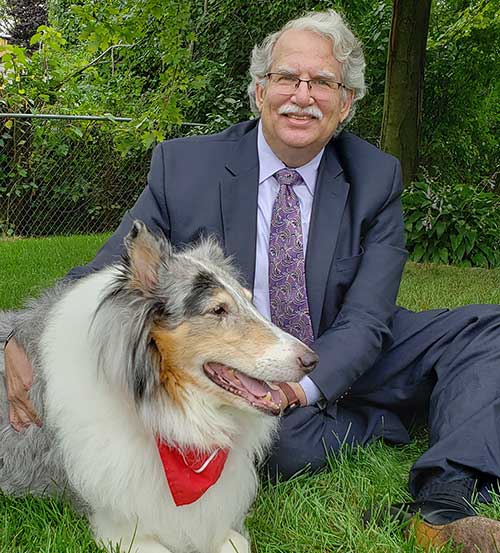 picture of attorney Mark E. Sostarich with his dog.